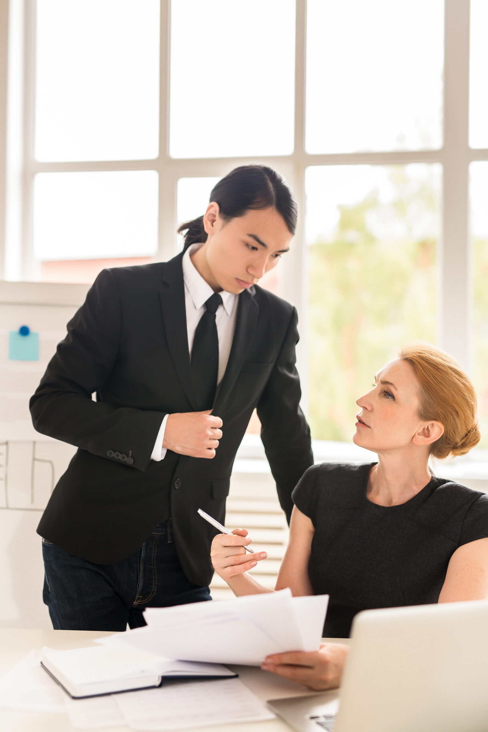 two coworkers discussing Cascading Restraint Clauses